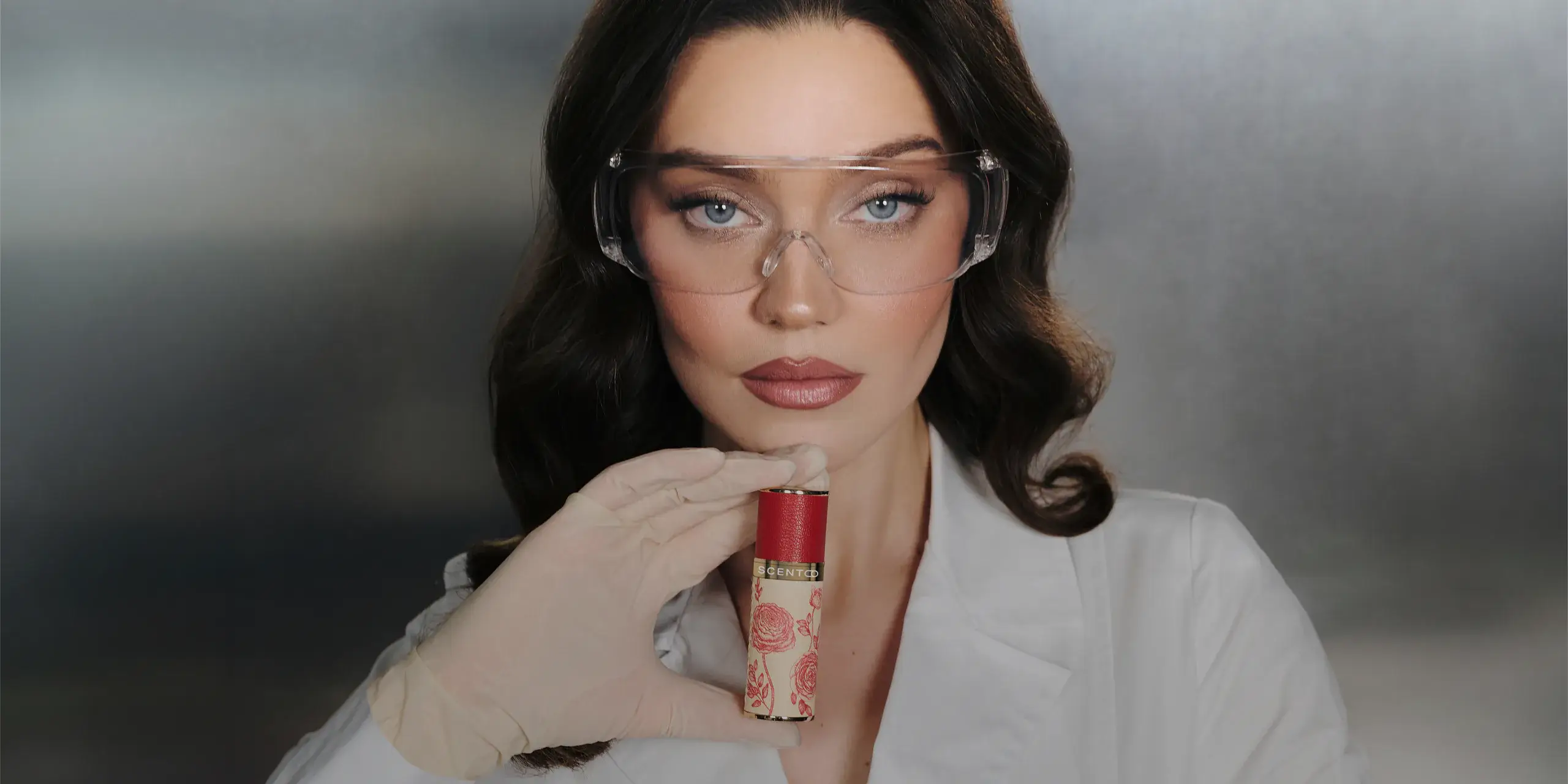 Scento fragrance atelier — holding an authentic perfume decant